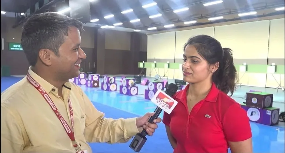 Rahul Sharma reporting on-field with a Bansal News microphone