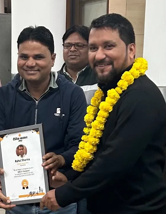 Rahul Sharma being felicitated with a journalism award certificate